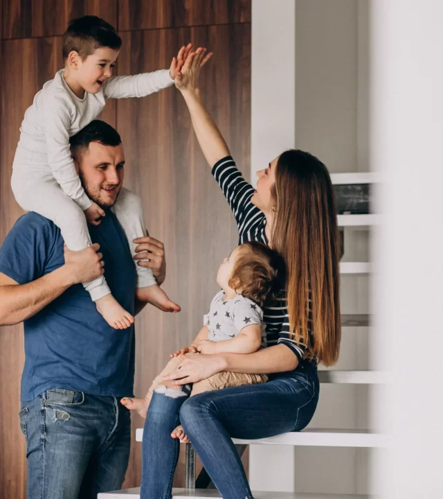 young-family-with-their-little-son-home-having-fun